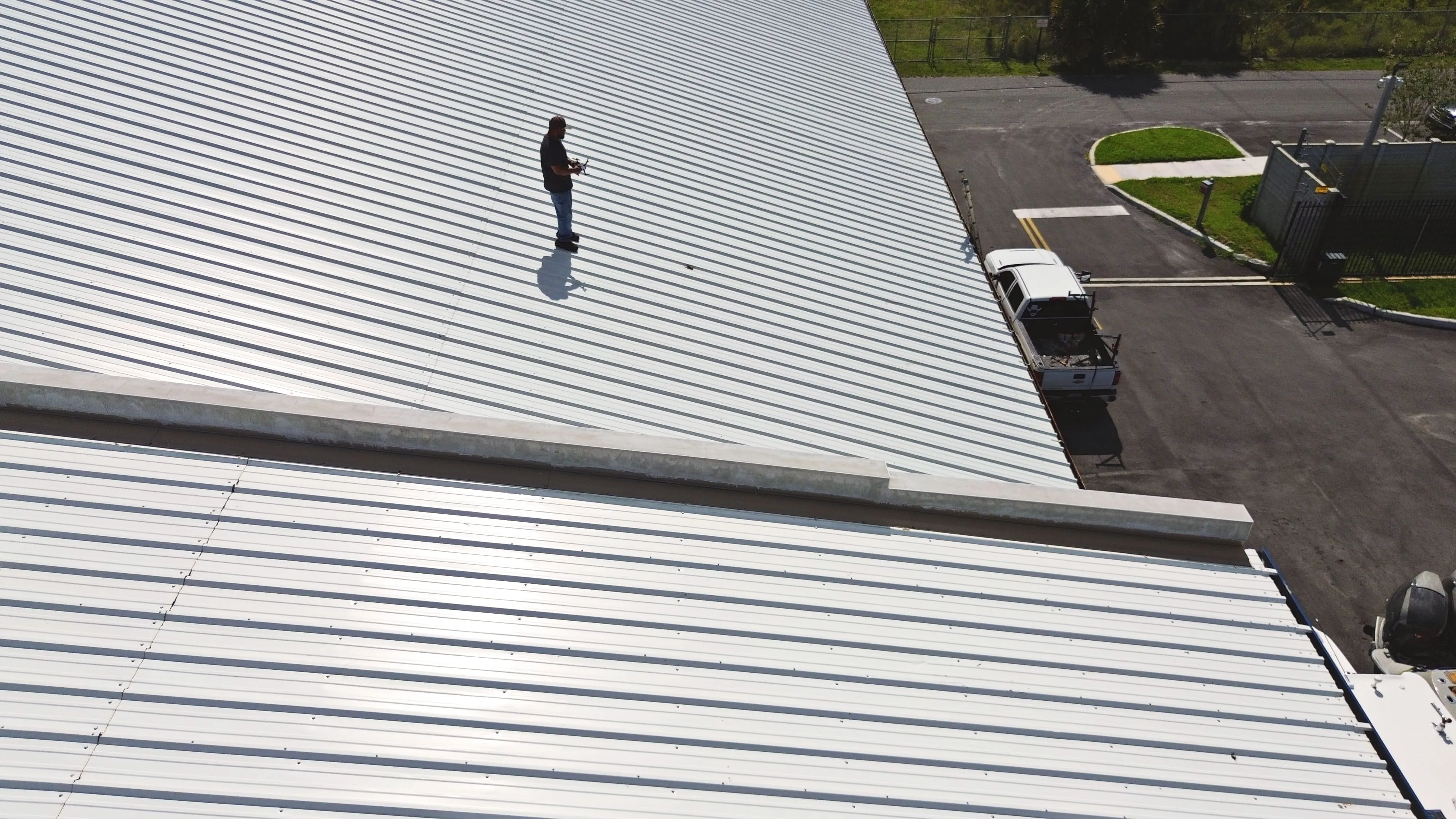 man on a commercial roof
