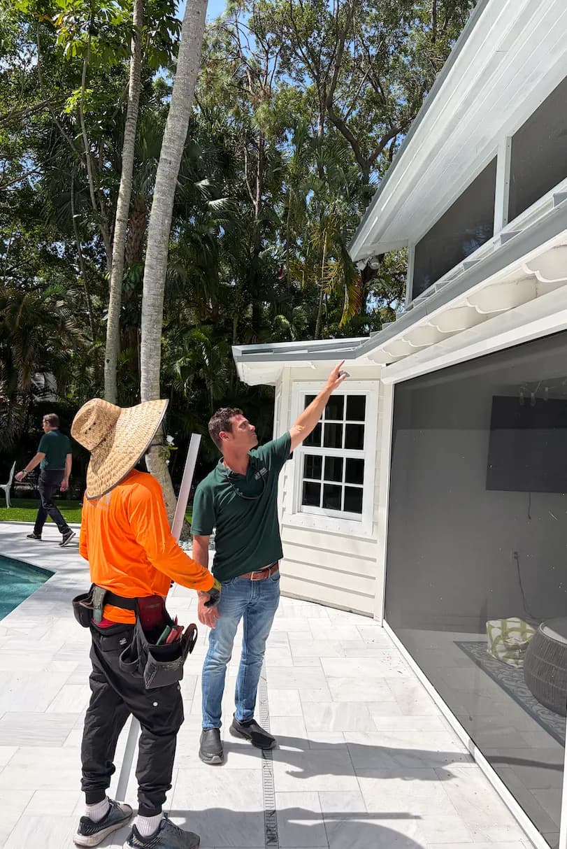 EcoSmart Construct specialist repairing roof damage on South Florida home