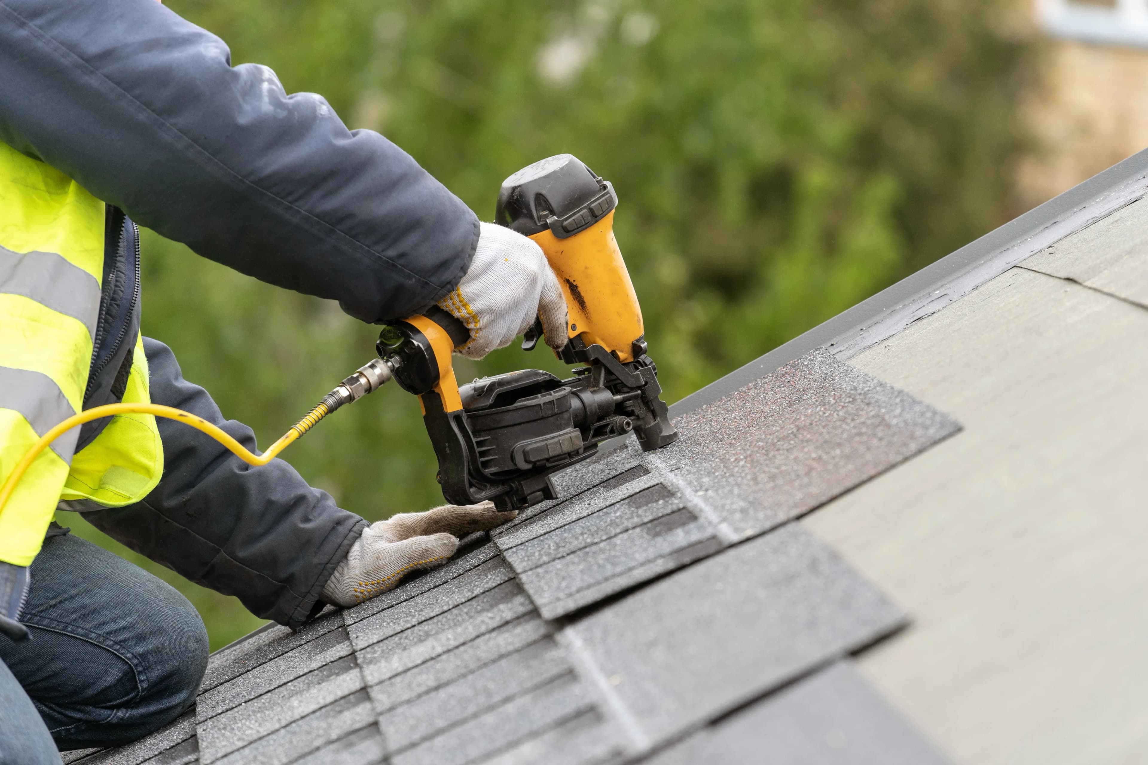 EcoSmart Construct roofer completing repair on residential roof, Broward County