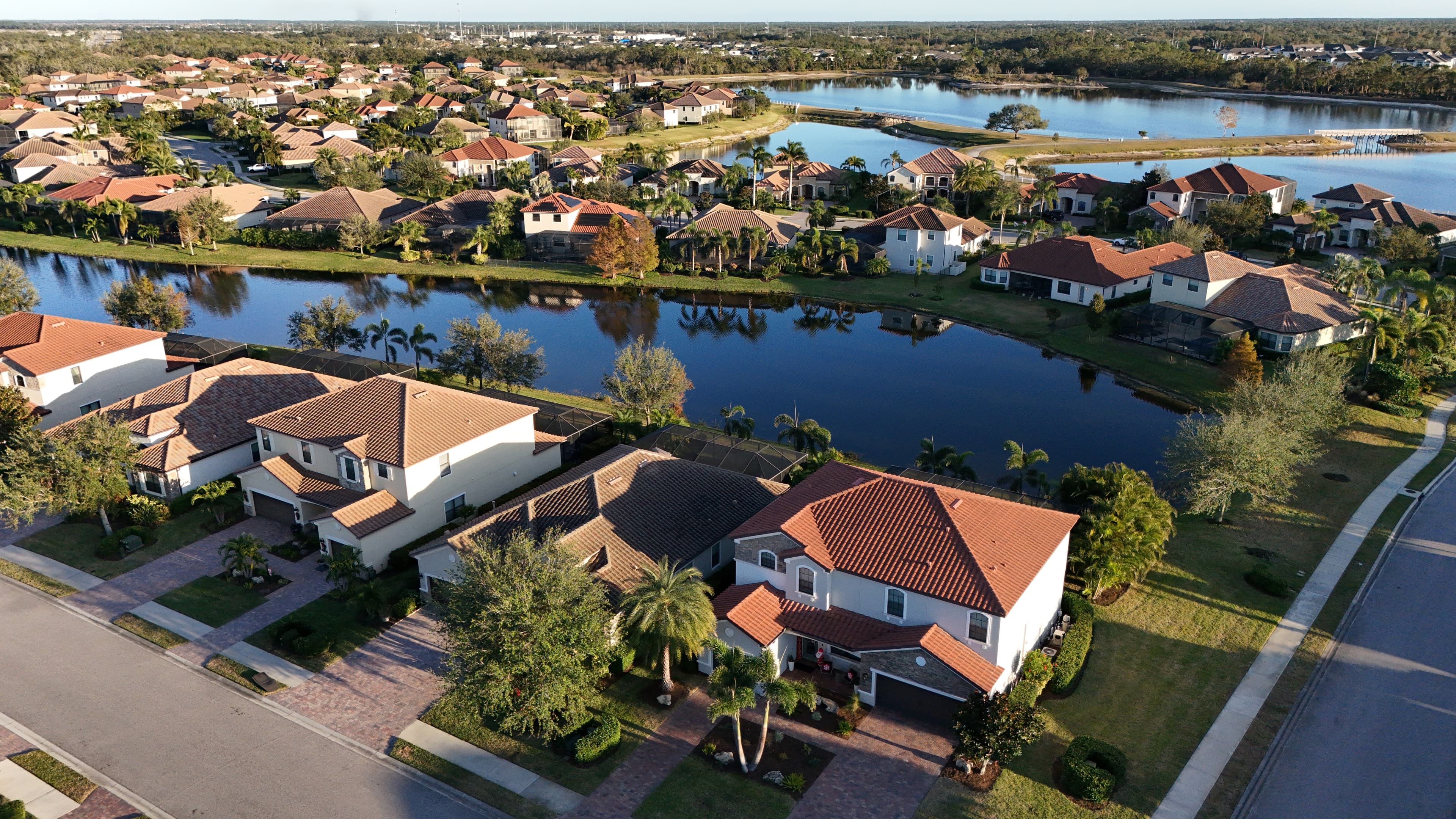EcoSmart Construct roofing crew at work on South Florida residential home, blue sky